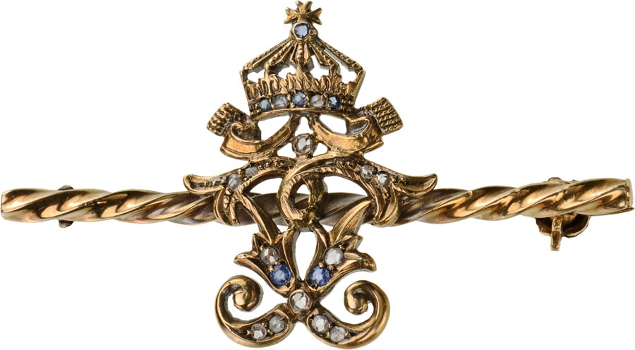 Brooch with the Royal Cypher of Tsar Ferdinand I: Breast Badge, 21,4 x 12 mm., GOLD, â??mirrorâ??-type, latin, crowned cypher of Tsar Ferdinand, set with Diamonds, mounted on a horizontal, twisted, golden bar of square section, the reverse fitted w