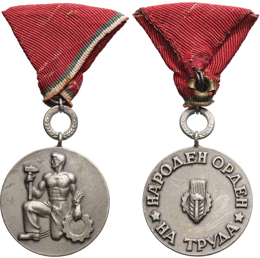 Order of People,s Labor, 2nd Class, 1st Emission with Wreath: Breast Badge, 46x34 mm., silvered Bronze, original suspension ring and ribbon. Extremely fine condition and scarce! I R!