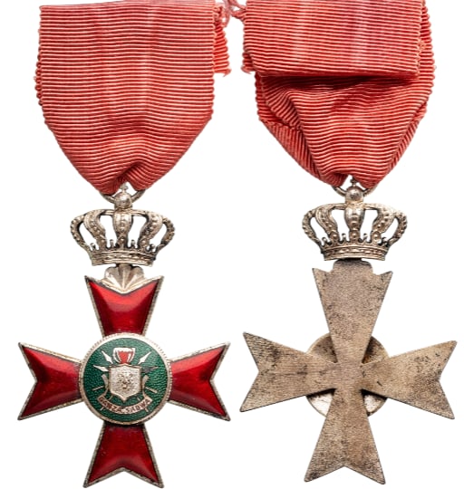 The Royal Order of Karyenda (Ordre Royal du Karyenda): founded by King Mwambutsa IV on 1st July: Knight`s Cross. Breast Badge, silvered, 81x61 mm, one side enameled, original suspension crown, ring and ribbon. Scarce and very attractive, in perfect condition! I R!