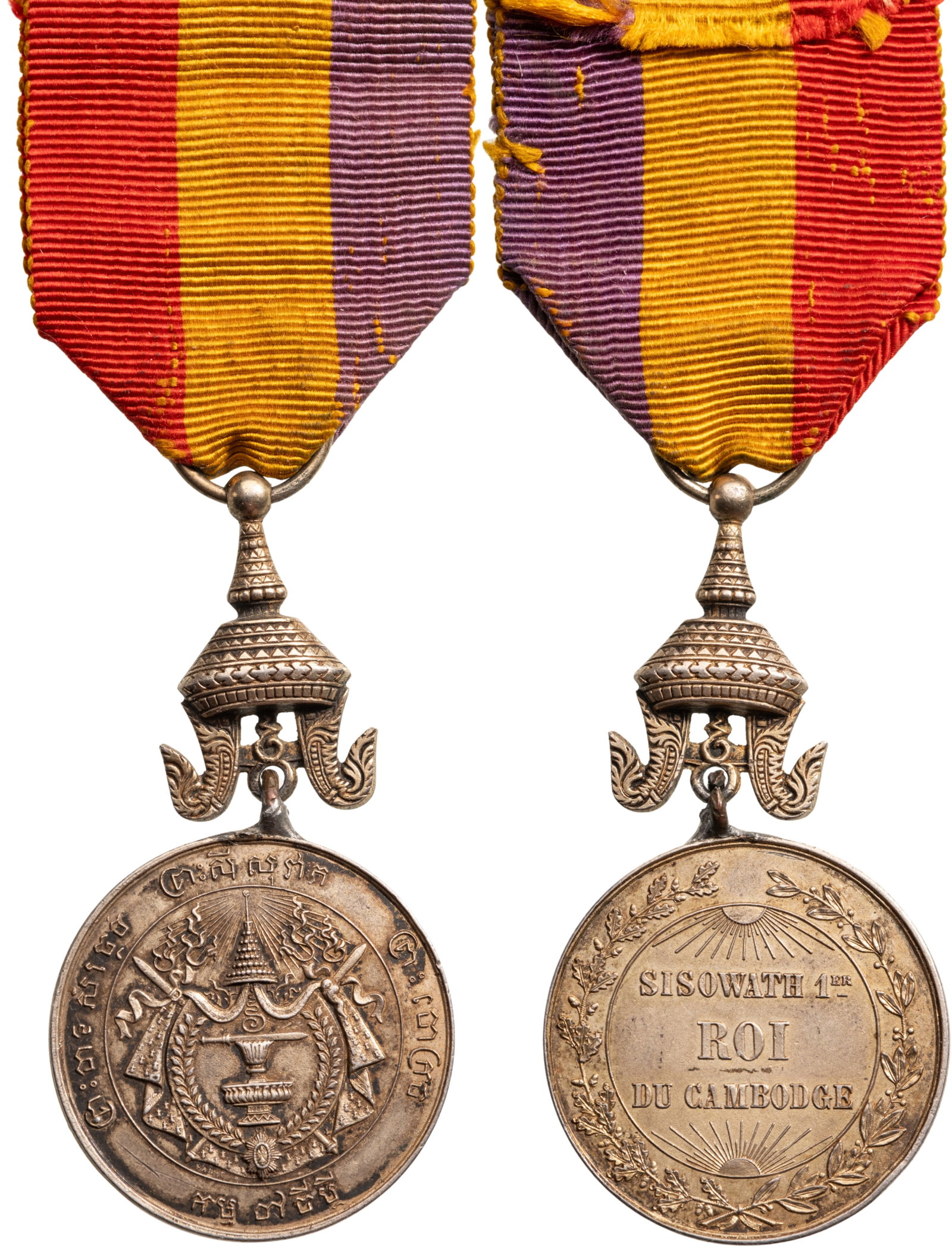 Coronation Medal of King Sisowath 1st, 1906: Breast Badge, 63x32 mm, Silver, original suspension crown, ring and ribbon. Very attractive, in extremely fine condition! I