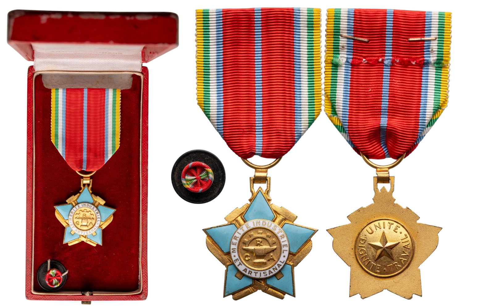 The Order of Industrial and Artisanal Merit: Knight's Cross, 5th Class, instituted in 1959. Breast Badge, 37x34 mm., gilt Bronze, one side enameled, original suspension ring and ribbon, in case of issue by "Arthus Bertrand Paris", together with 