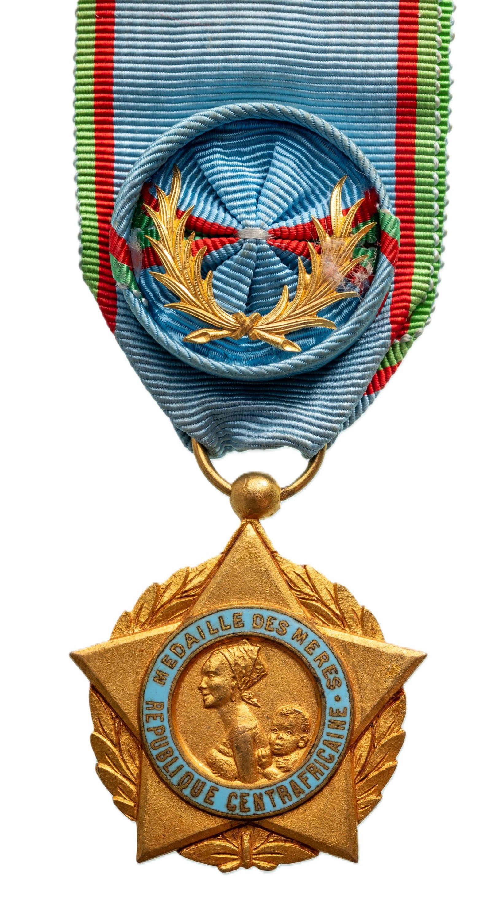 Medal of Honour for the Mothers: 1st Class, for 13 Children, instituted in 1966. Breast Badge, 51x46 mm., gilt Bronze, one side enameled, original suspension ring and ribbon with rosette and gilt palms. Mint state! I