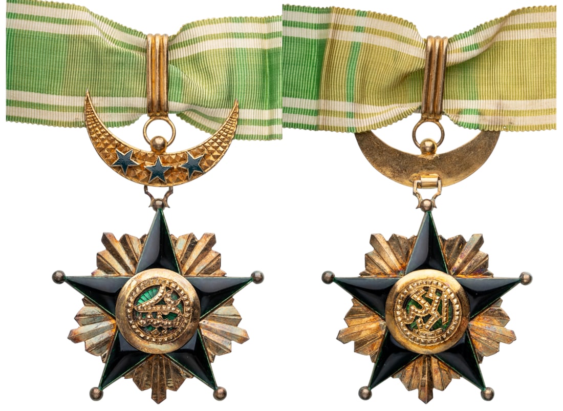Order of the Star of Grand Comoros (SAID ALI): Commander's Cross, 4th Class. instituted in 1910. Breast Badge, 101x71 mm., gilt Silver, enameled, original suspension crescent, ring, loop and ribbon. Mint state, superb and scarce! I R!