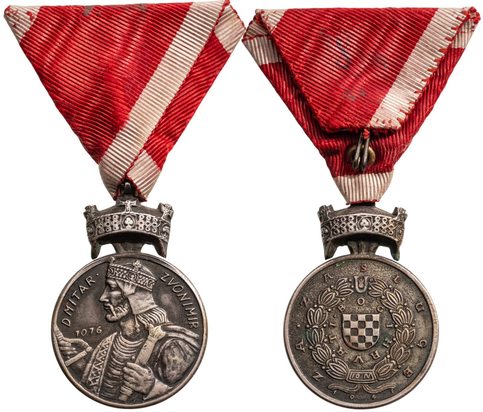 Silver Medal of the Order of The Crown Of King Zvonimir: Silver Medal, instituted in 1941. Breast Badge, 47x32 mm., Silver, original suspension ring and triangular ribbon. Extremely fine condition! I