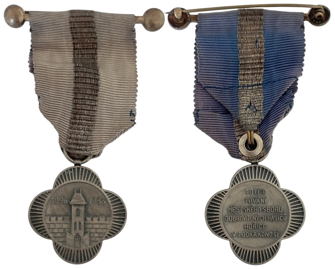 40th Anniversary Medal of the Municipal Volunteer Fire Brigade of Horice in Podkrkonosi: Breast Badge, 37x35 mm., Silver, original suspension ring and ribbon with bar. A badge in extremely fine condition! I