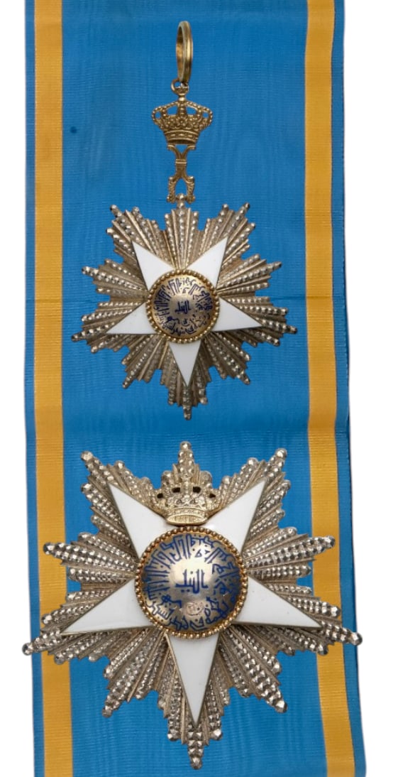 ORDER OF THE NILE: Grand Cross Set, 1st Class, instituted in 1915. Sash Badge, 93x63 mm, partially gilt Silver, enameled, superimposed part gilt enameled, maker`s mark "Lattes", with original gilt suspension crown,
