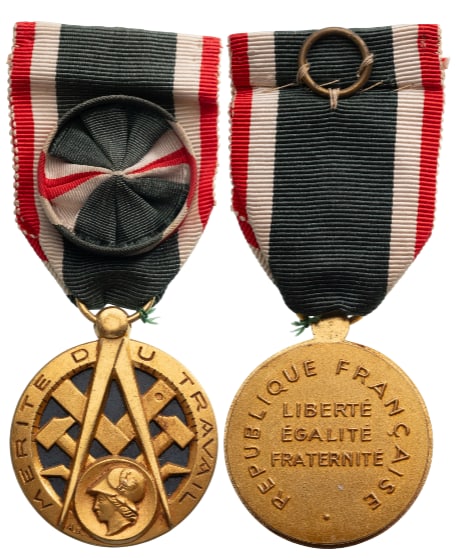 LABOUR MERIT ORDER: Officer`s Cross, 4th Republic, 2nd Class, instituted in 1957. Neck Badge, 48x41 mm., gilt Bronze, original suspension ring and ribbon and rosette. Scarce and extremely fine condition! I