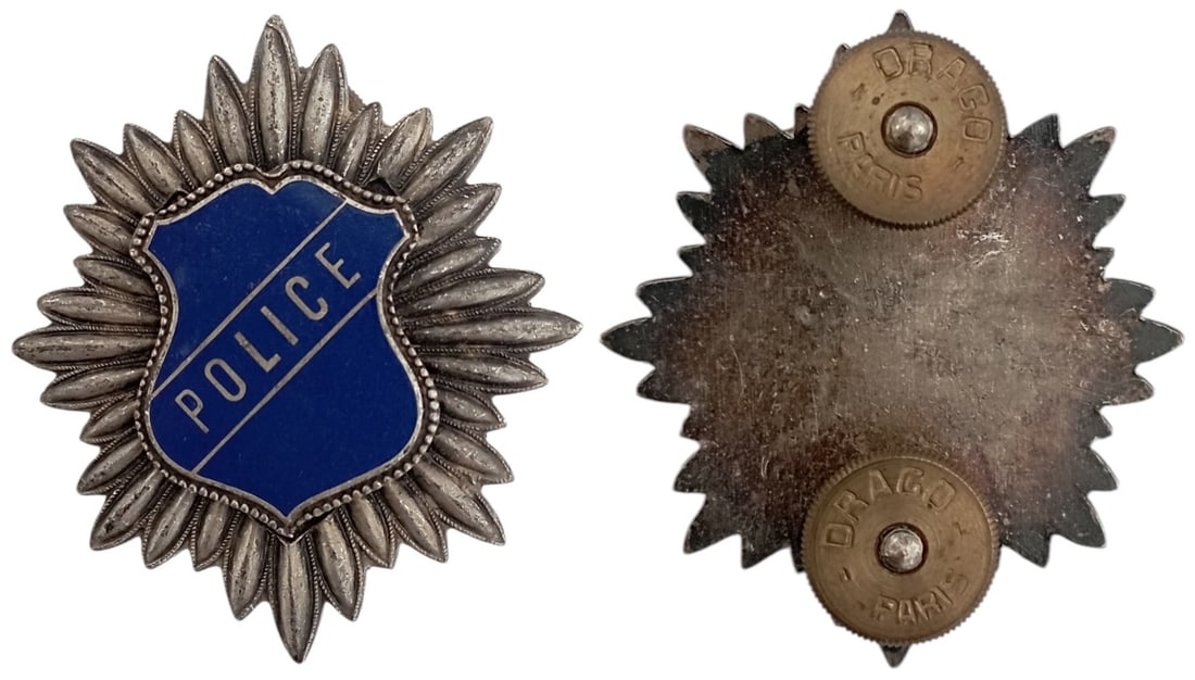 Police Badge: Breast Badge, 39 mm, silvered Bronze, one-side enameled, by "Drago, Paris", 2 fixation screws on reverse. I