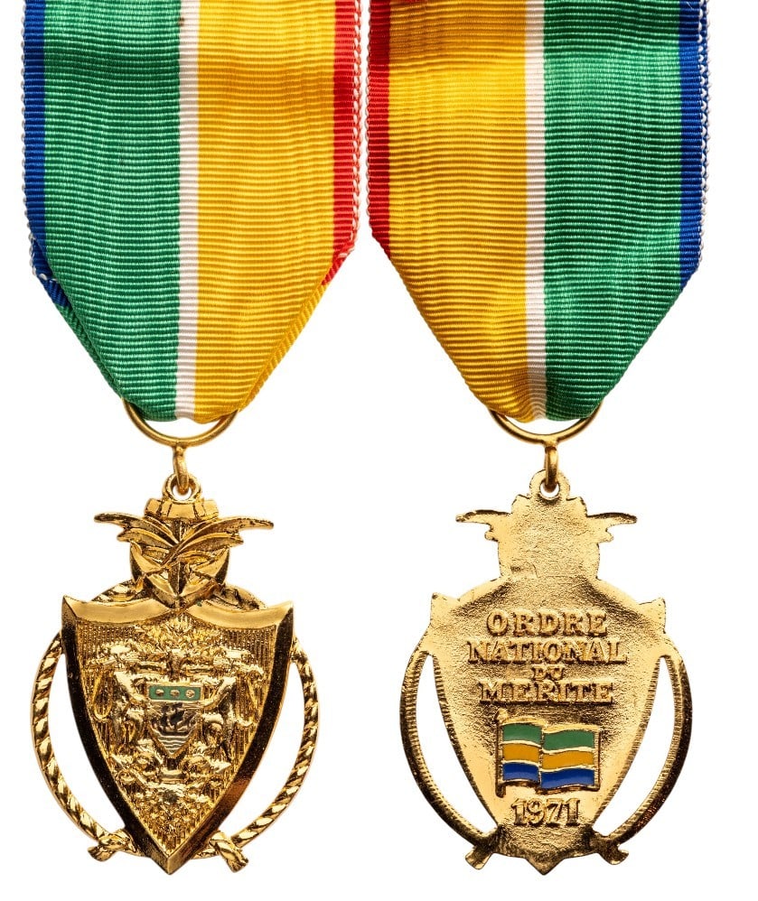 NATIONAL ORDER OF MERIT: Knight's Cross, instituted in 1971. Breast Badge, 45x32 gilt Bronze, both sides enameled, original suspension ring and ribbon. Extremely fine! I