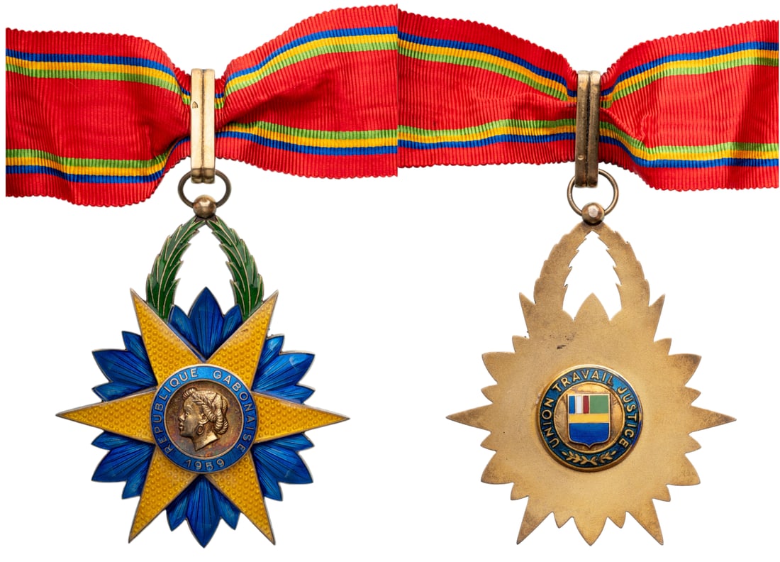Order of The Equatorial Star: Commander's Cross, instittued in 1959. Neck Badge, 75x62 mm., gilt Silver, hallmarked,"800", maker's mark, enameled, original suspension ring, loop and ribbon. Superb badge, in extremely fine