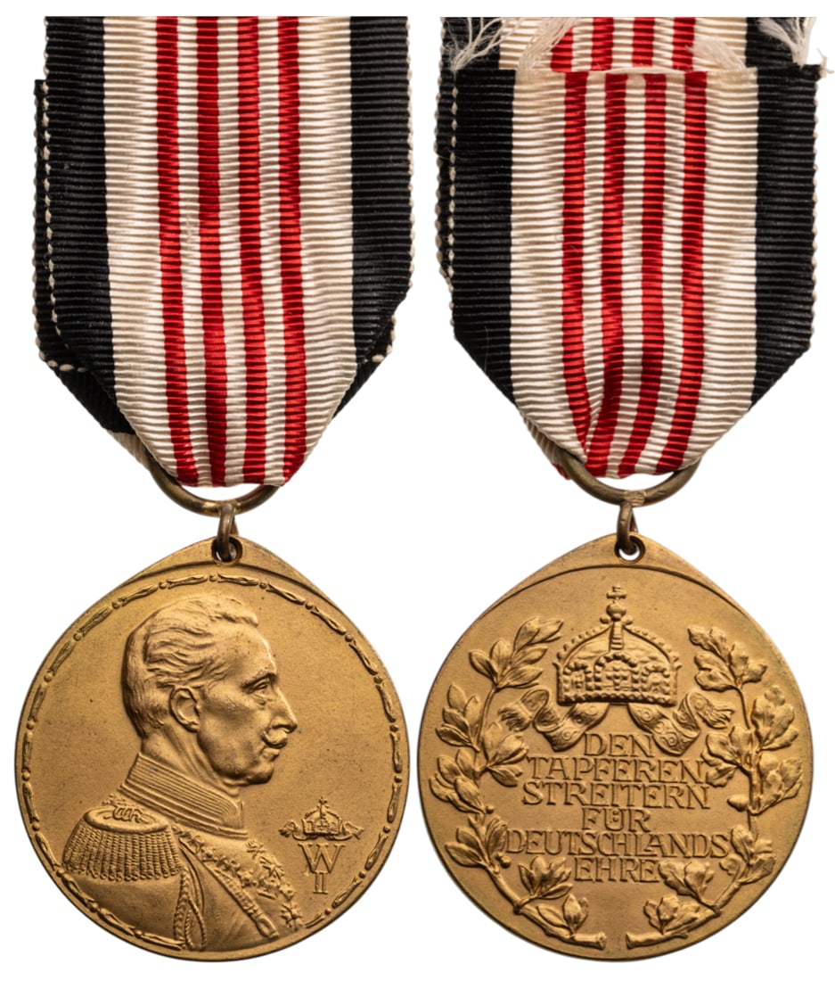 Colonial Medal for Combatants of the German Protection Force, 1912: Breast Badge, 35x32 mm, gilt Bronze, original suspension ring and ribbon. Extremely fine condition! I