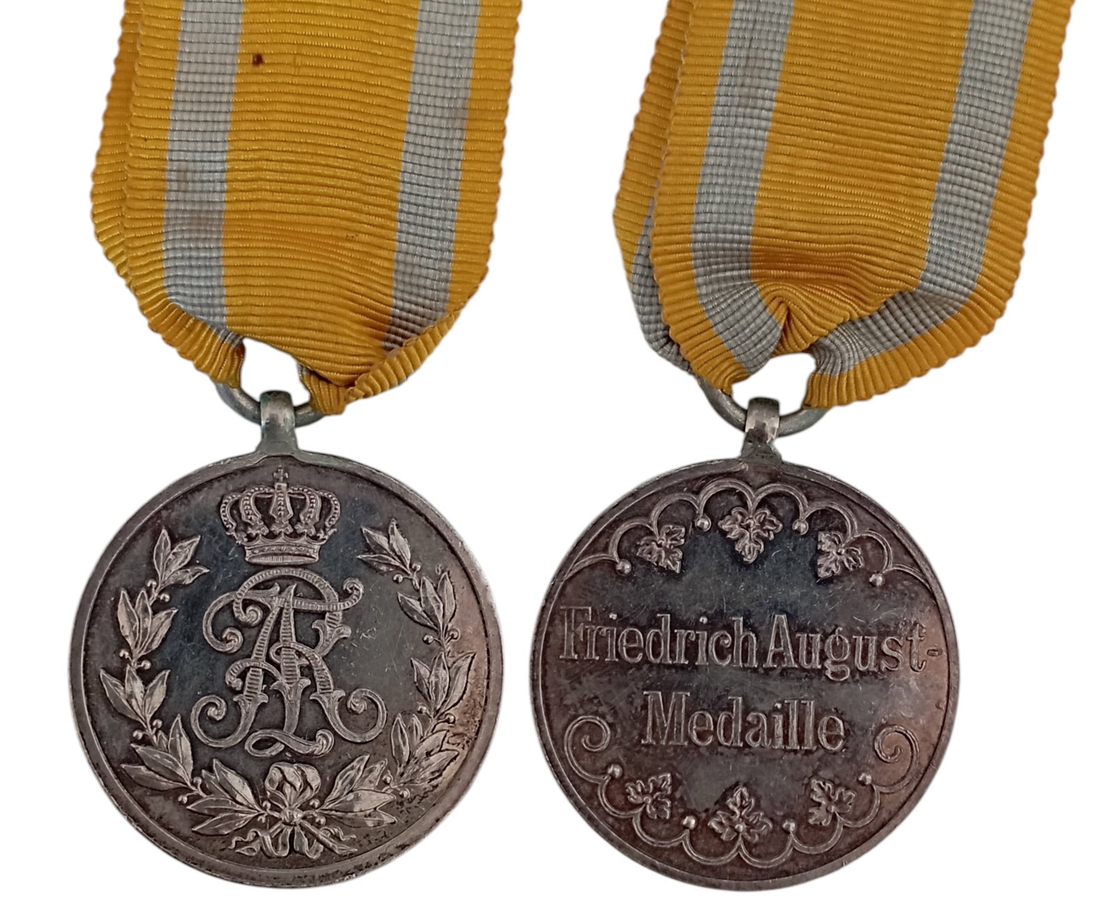 Friedrich August Medal for Military Merit, Silver Class, 1905: Breast Badge, 29 mm, Silver, original suspension ring and ribbon. A superb medal in mint condition! I