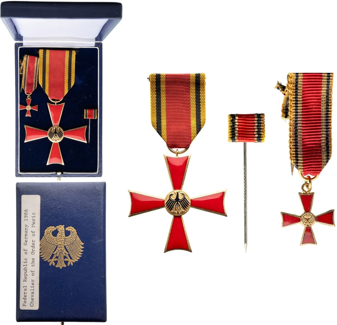 ORDER OF MERIT OF THE FEDERAL REPUBLIC: Knight's Cross, instituted in 1951. Breast Badge, 57x55 mm., gilt Metal, one-side enameled, original suspension ring and ribbon, together with enameled miniature and pin, in case of issue with gilt Ge
