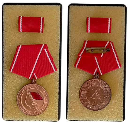 Medal for Outstanding Achievments within the Working Class Combat Groups: Breast Badge, 36x32 mm., Copper, enameled, original suspension ring and ribbon, in case of issue, together with ribbon bar. Mint condition! I