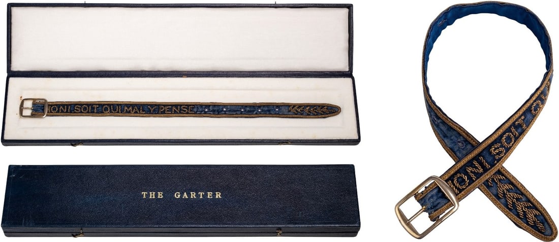 The Most Noble Order of the Garter: Garter made of blue silk, with thick, gilt-silver bullion wire (toned) embroidery with the Order's motto "HONI SOIT QUI MAL Y PENSE" and laurel leaves; fire-gilt buckle. A beautiful piece, in extremel