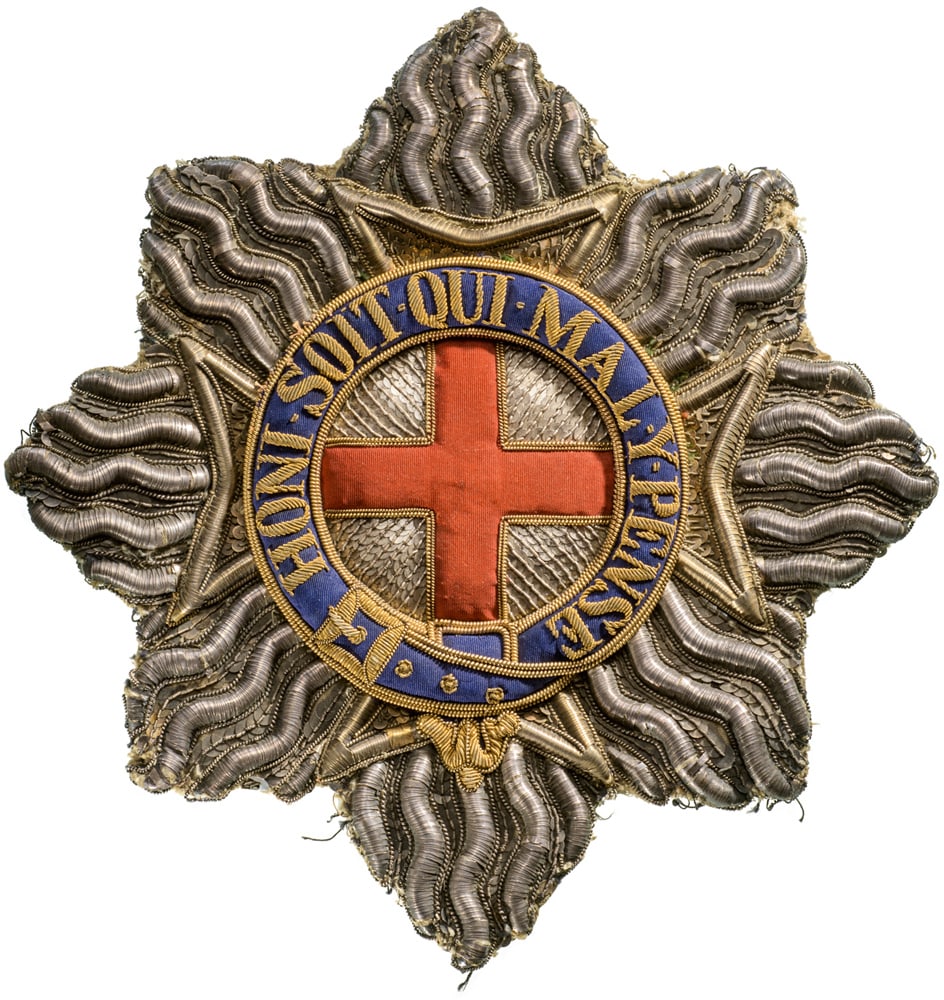 The Most Noble Order of the Garter: An early embroidered mantle Star to a Knight of the Order, 230x240 mm, the rays of silver wire and sequines, the centre with thin, red woolen cross within thick silver embroidery, the outer circlet ma