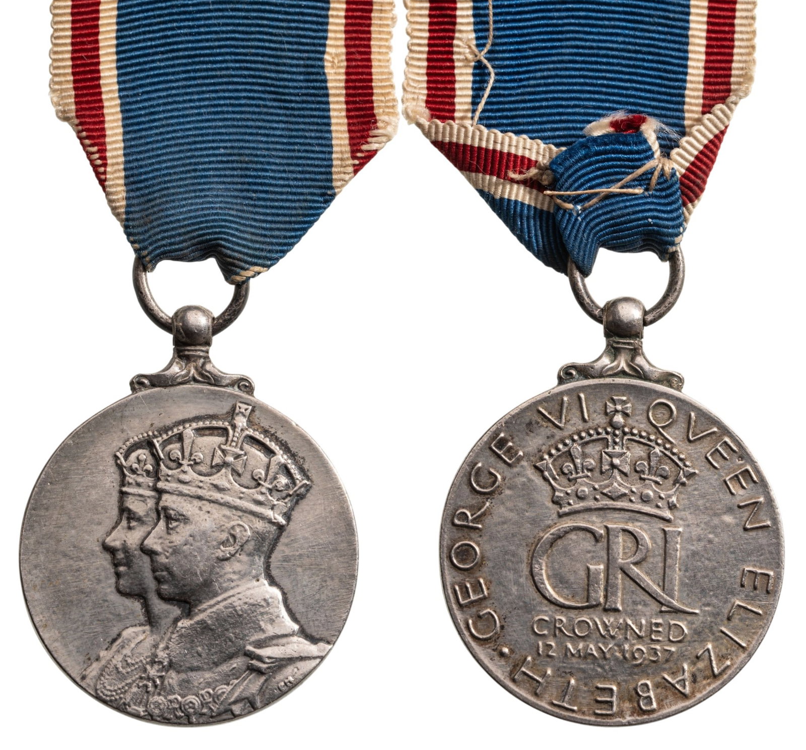 Coronation Medal, King George VI and Queen Elizabeth, 1937: Breast Badge, 39x31 mm, Silver, original suspension ring and ribbon. Extremely fine condition! I