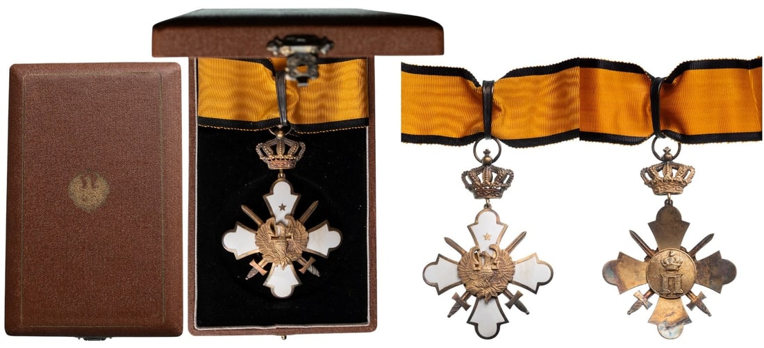 Order of the Phoenix: Commander's Cross with Swords, 2nd Type. Neck Badge 84x57 mm, gilt Silver and white enamel, obverse centre with convex phoenix rising from the flames, crossed swords between the cross's arms, reverse 