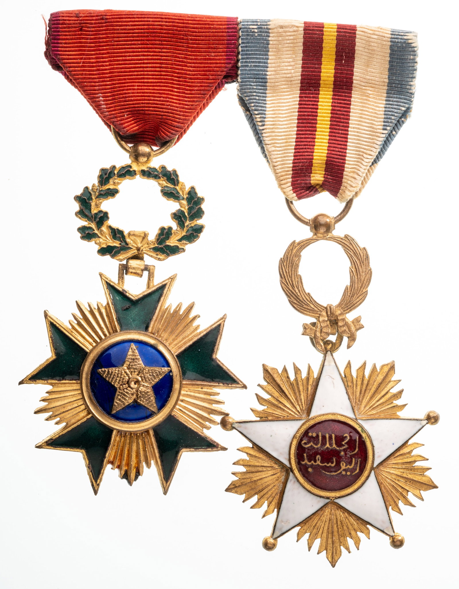 Bar of 2. Counani Order of Commercial Merit and Medal of the supporters of Mouly Yussef, who the: Knight's Crosses. Breast Badges, 69x43 and 67x44 mm, gilt Bronze, one side enameled, suspension wreaths, rings and original ribbons. A very rare group, in extremely fine condition. I RR!