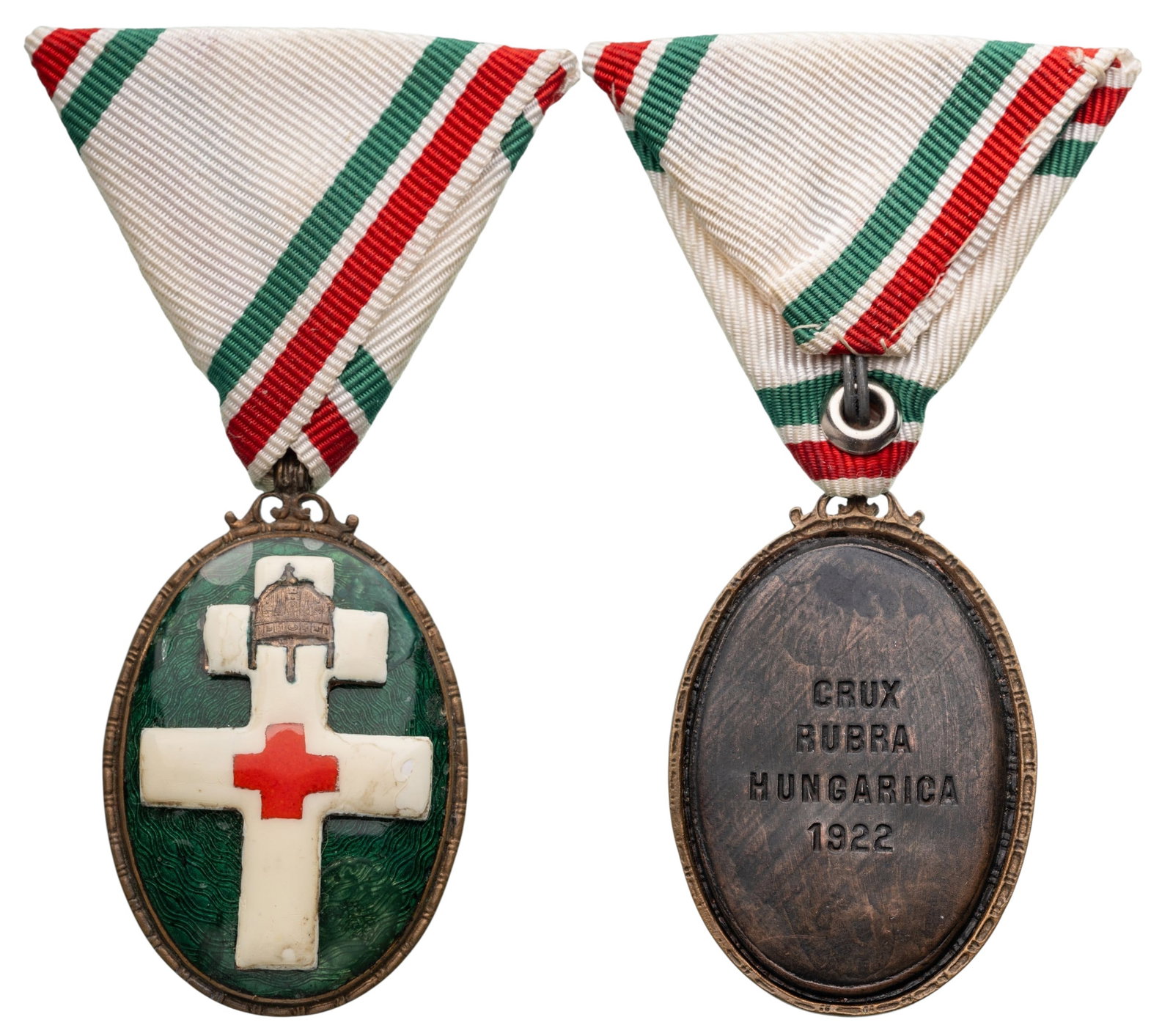Decoration of the Hungarian Red Cross: Medal of Merit, instituted in 1922. Breast Badge, 53x34 mm, Bronze, reverse inscription with dates "CRUZ RUBRA HUNGARICA 1922", one side enameled, original suspension ring and triangularar ribbon.