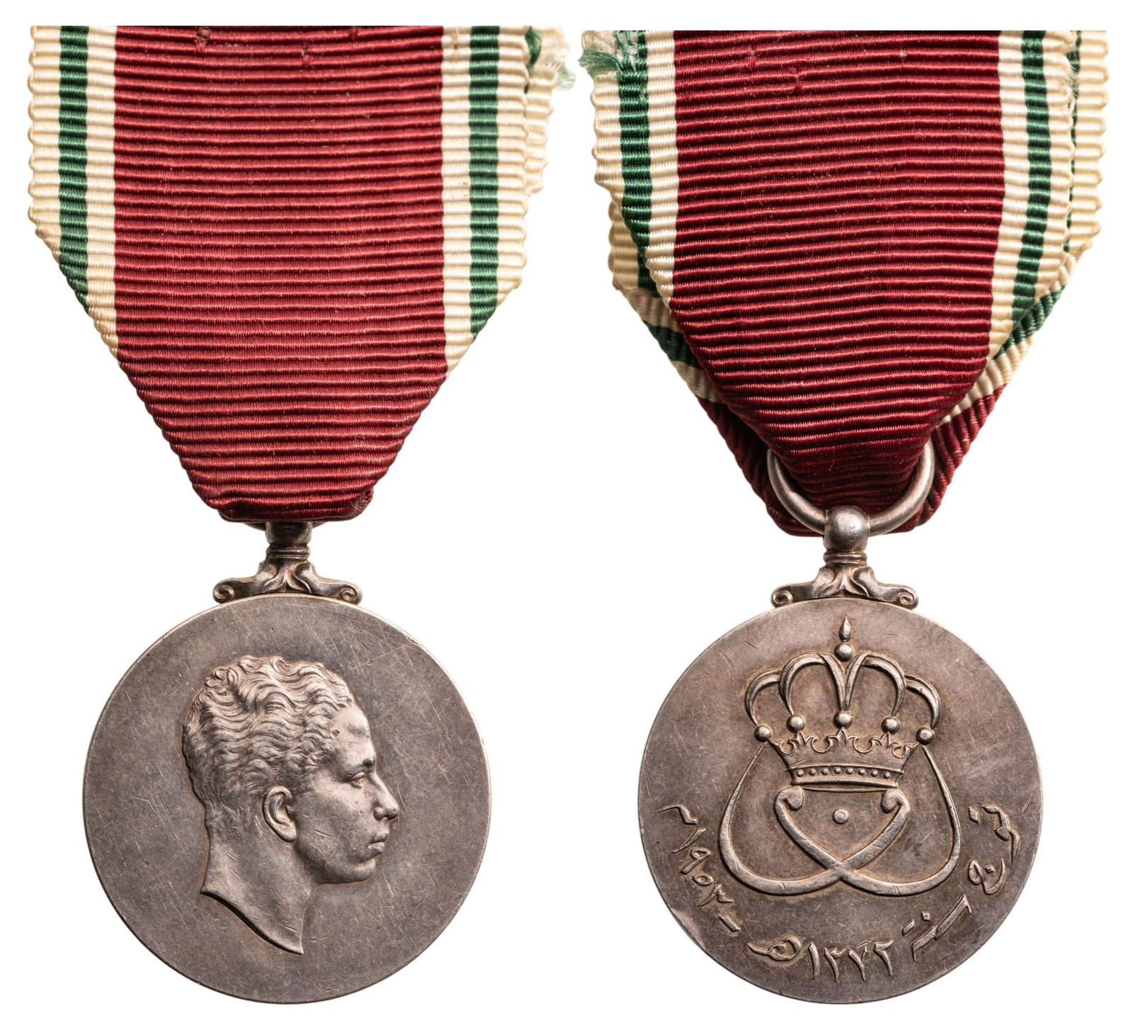 Coronation Medal of King Faisal, 1953: Silver Class. Breast Badge, 39x32 mm, Silver, original suspension ring and ribbon. Very attractive and rare! I R!