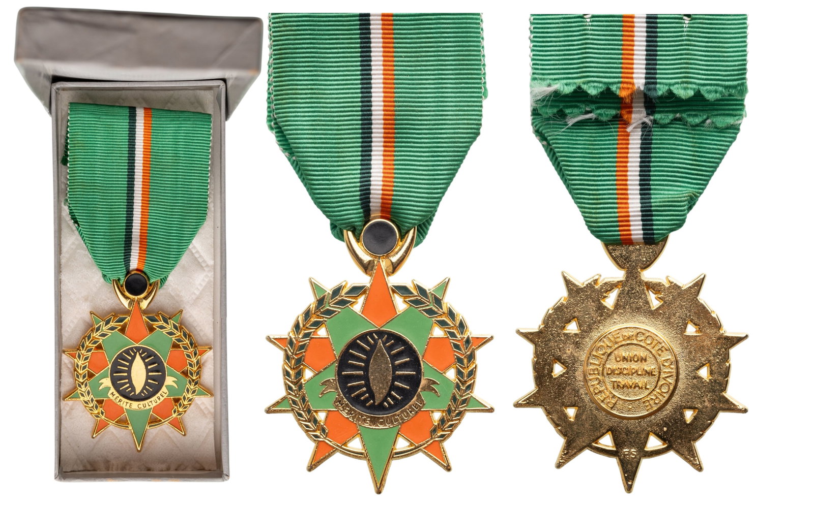 Medal of Cultural Merit: Breast Badge, 48x42 mm., gilt Bronze, one-side enameled, central medallion gilt, enameled, original gilt suspension and ribbon, in case of issue by "Van Larebeke, Bruxelles". Extremely fine condition!