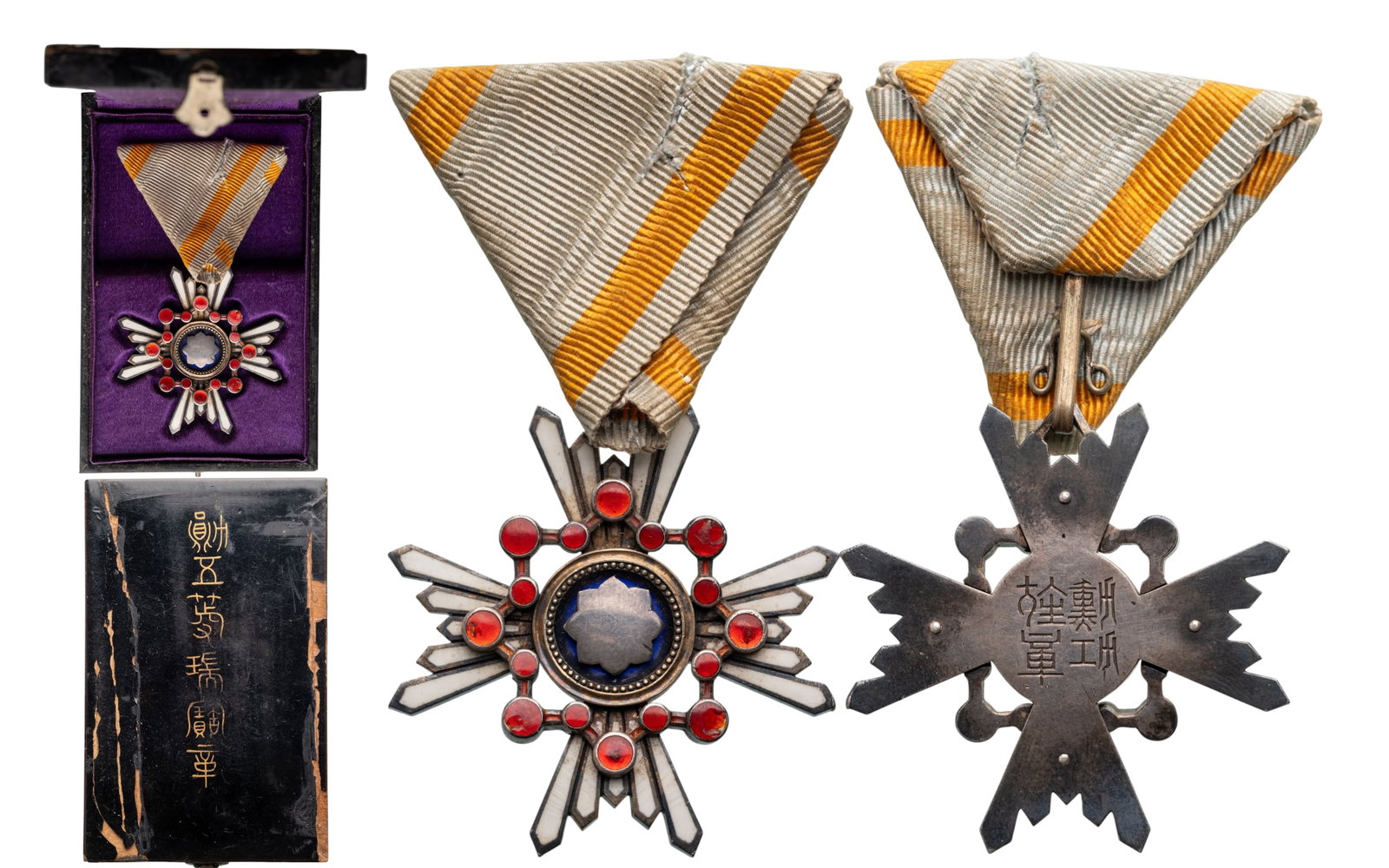 ORDER OF THE SACRED TREASURE (Kunnito zuihisho): 5th Class, instituted in 1888. Breast Badge, 44 mm., partially gilt Silver, enameled, reverse with Japanese inscriptions, suspension on ribbon, in laquered damaged case of issue, with inscription on t