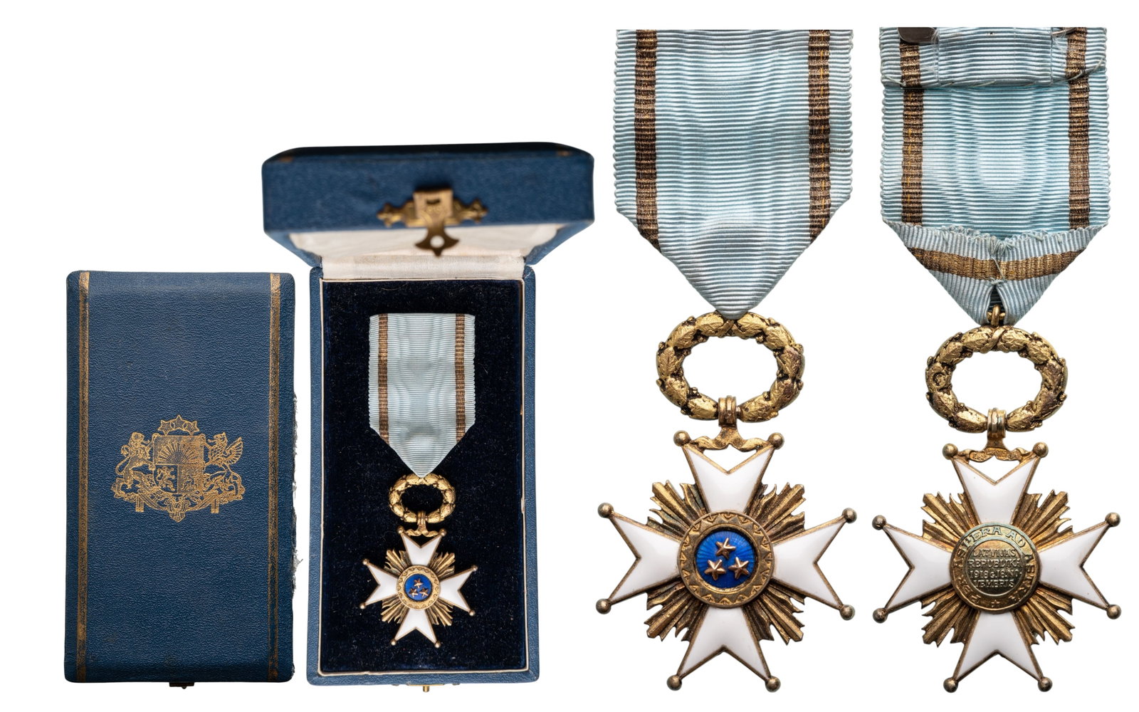 Order of the 3 Stars: Officer's Cross, instituted in 1924. Breast Badge, 56x38 mm., gilt Silver, both sides enameled, original suspension ring and ribbon, in case of issue with gilt weapon on the lid. Extremely fine! I