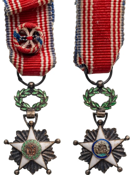 ORDER OF THE AFRICAN REDEMPTION: Officer's Cross Miniature, instituted in 1879. Breast Badge, 24x14 mm, Silver, hallmarked,, enameled, original suspension wreath, ring and ribbon with rosette. Superb! I
