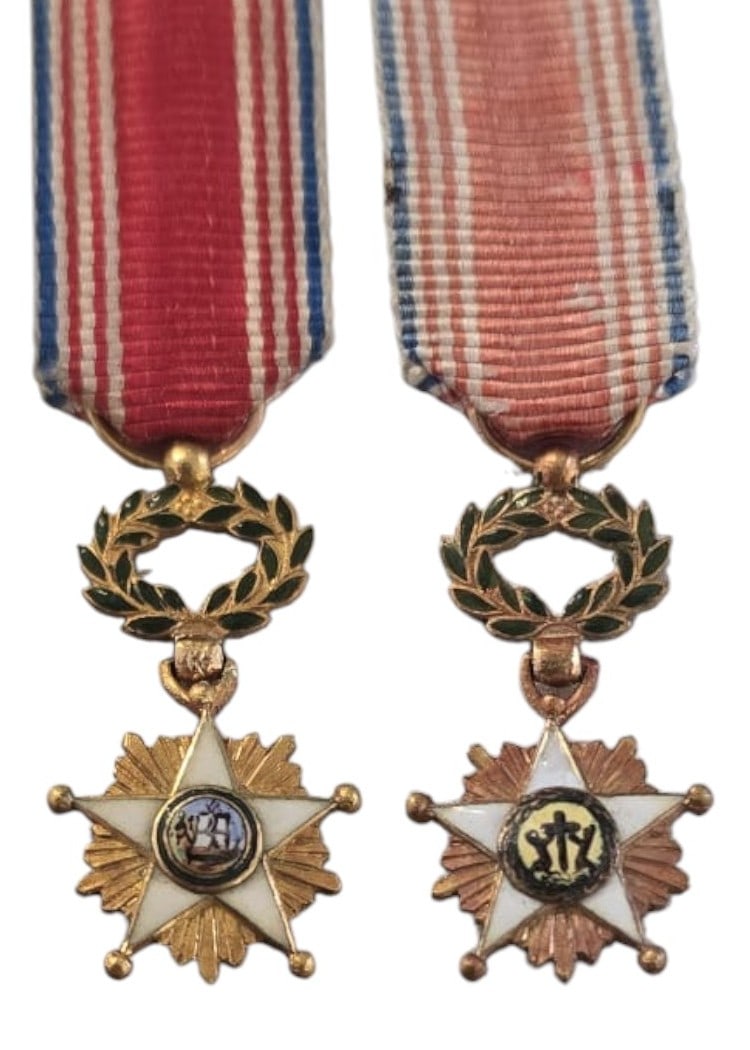 ORDER OF THE AFRICAN REDEMPTION: Miniature, instituted in 1879. Breast Badge, 20x11 mm, GOLD, enameled, central medalion gold, original suspension wreath, ring and ribbon. Rare and superb! I R!