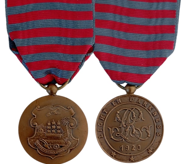 Medal of Merit of the Order of the Star of Africa, 1920: Breast Badge, 35x30 mm, Bronze, original suspension ring and ribbon. Very attractive medal, in mint condition! I