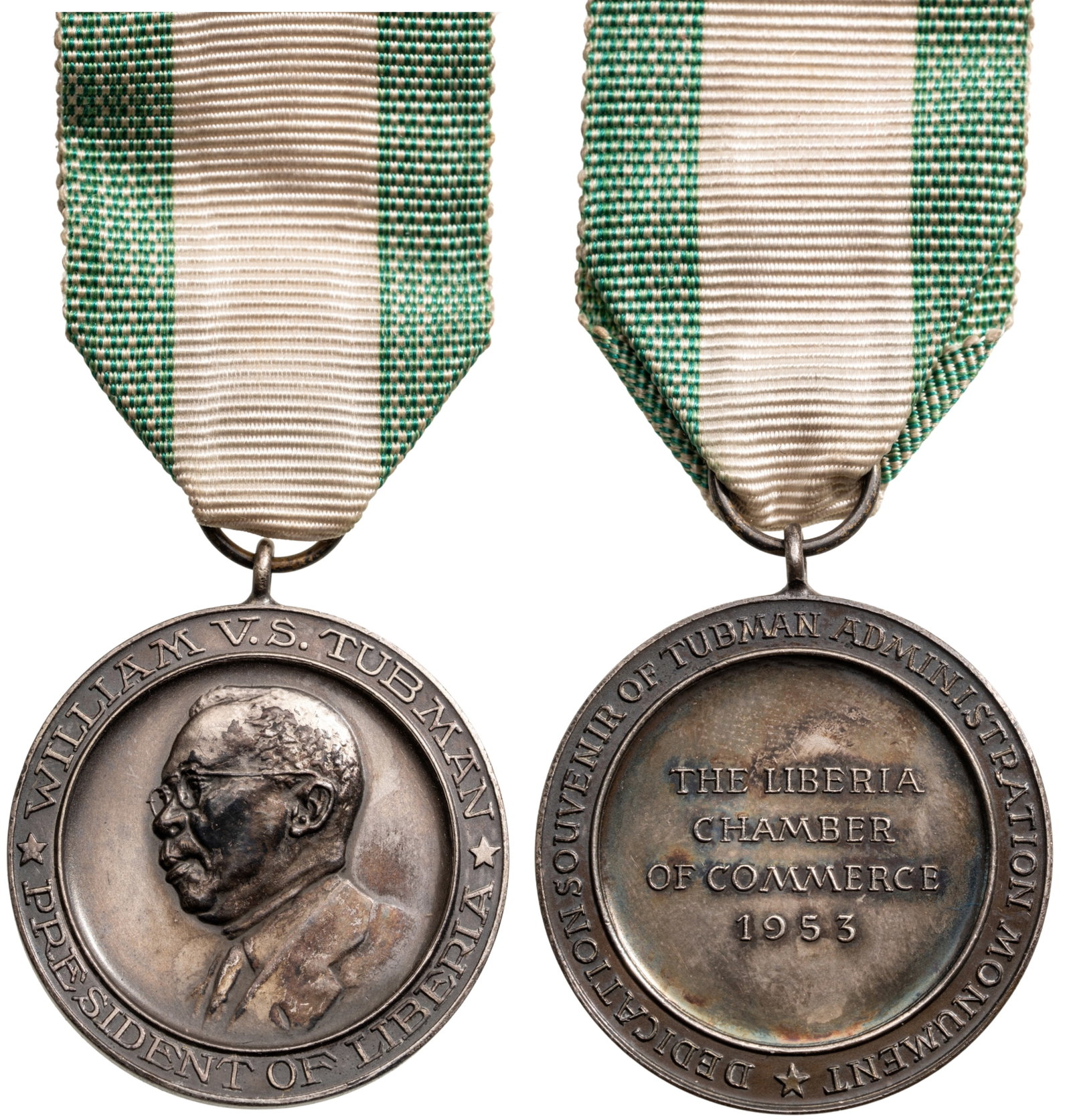 President William V. S. Tubman, Chamber of Commerce Medal, 1953: Breast Badge, 49x35 mm, Silver, original suspension ring and ribbon, with thin suspension pin. Extremely fine condition! I