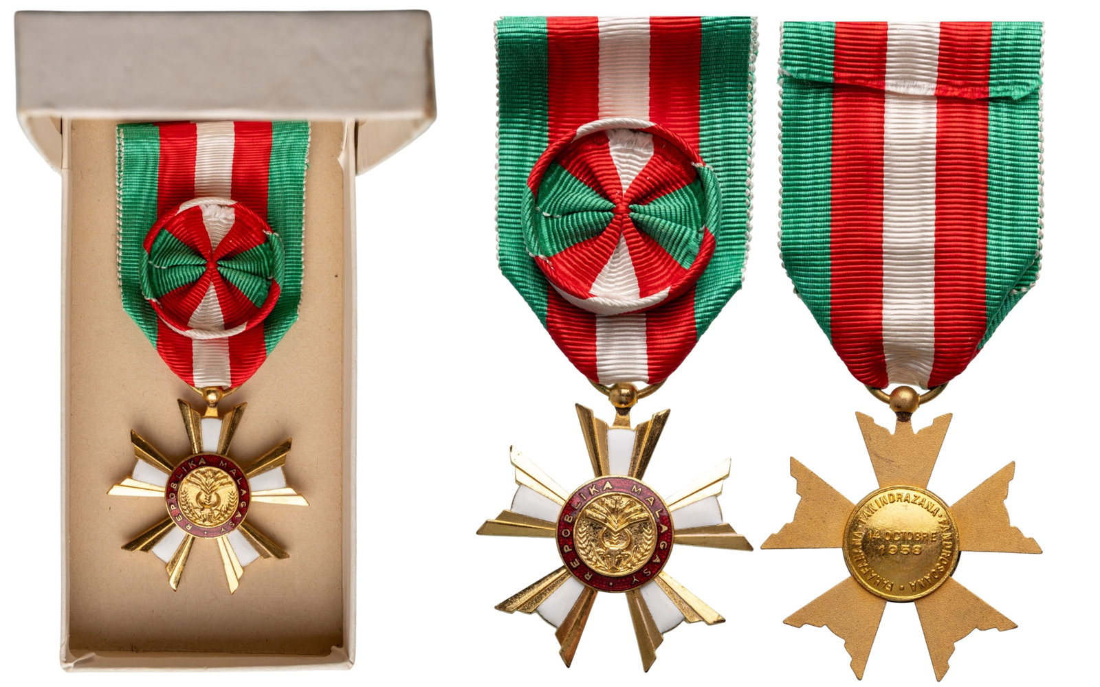 National Order of Madagascar: Knight's Cross, instittued in 1959. Breast Badge, 42x40 mm., gilt Bronze, one-side enameled, original suspension ring and ribbon with rosette, in case of issue. I