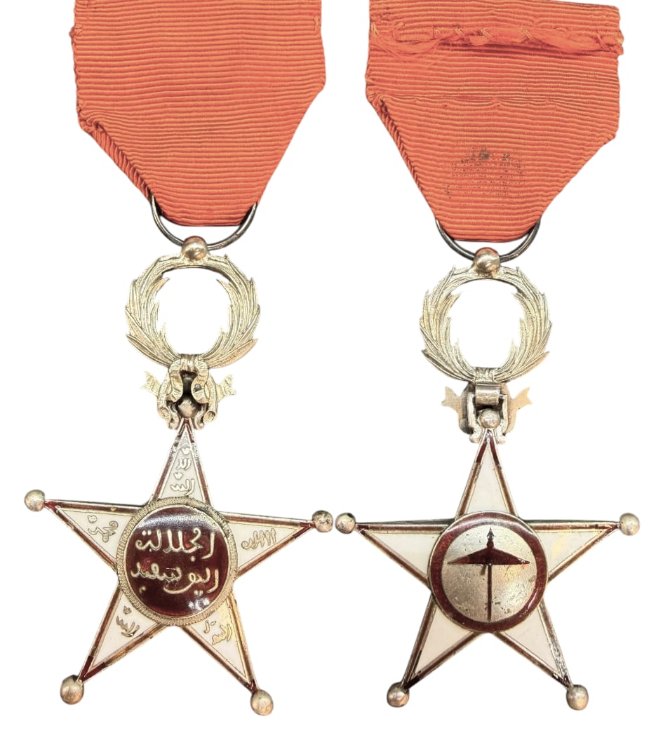 Order of Ouissam Alaouite: Knight's Cross, 1st Type, 5th Class, instituted in 1913. Breast Badge, 63x42 mm., Silver, both sides enameled, original suspension wreath, ring, loop and ribbon. Rare first model, in extremely fine co