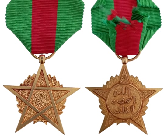 Star of Merit: 1st Class, instituted in 1939. Breast Badge, 43x41 mm., gilt Bronze, original suspension ring and short ribbon. Mint state! I