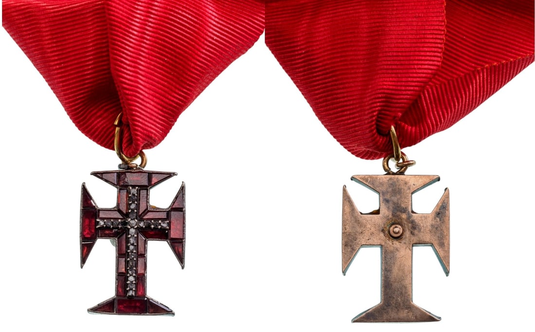 Military Order of Christ: Jewelled badge of reduced size, 30x19 mm, gilt Silver, the Orderâ??s cross set with red stones, within an elaborate pattern of foliage and round border, profusely set with diamonds, upper loop and or