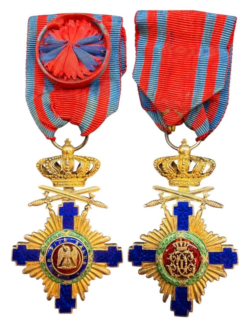 ORDER OF THE STAR OF ROMANIA, 1864: Officer's Cross, 4th Class, 1st Model (1877), for Military in Time of Peace. Breast Badge, 67x42 mm, gilt Silver, both sides enameled, original suspension ring and ribbon with rosette. Superb badge, i