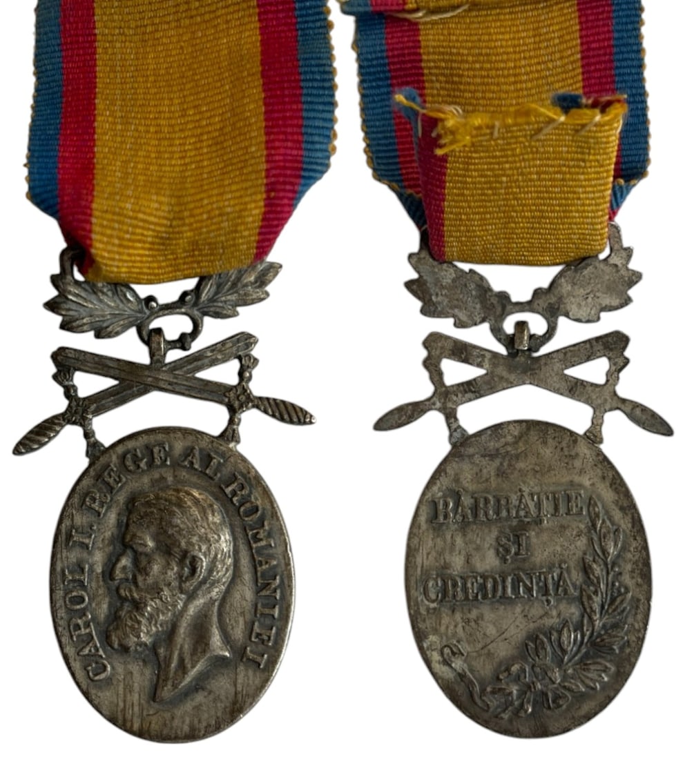Manhood and Loyalty Medal, 2nd Class, Military: Breast Badge, 58x28 mm., silvered Bronze, original suspension device and ribbon. Instituted on the 3rd of November 1903 for acts of courage and service to the state. I