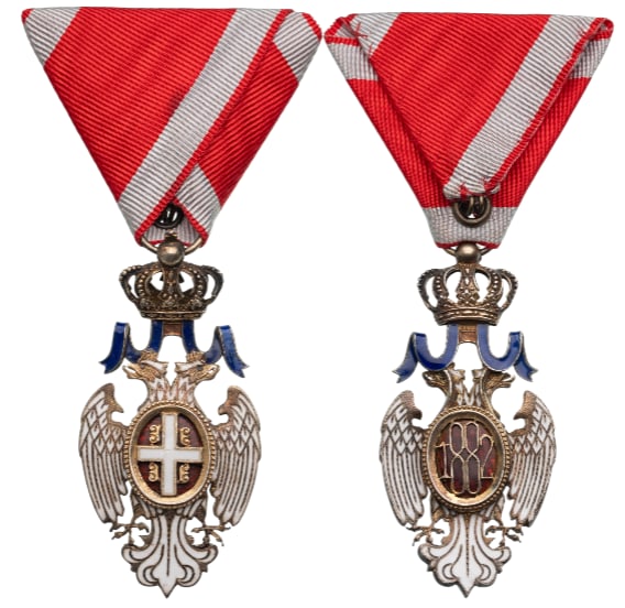 ORDER OF THE WHITE EAGLE: Knight's Cross, Civil, 2nd Model, 5th Class, instituted in 1883. Breast Badge, 66x33 mm, Silver, white enameled, oval centre medallion with the arms of Serbia on red enamel, outer circlet with diamond