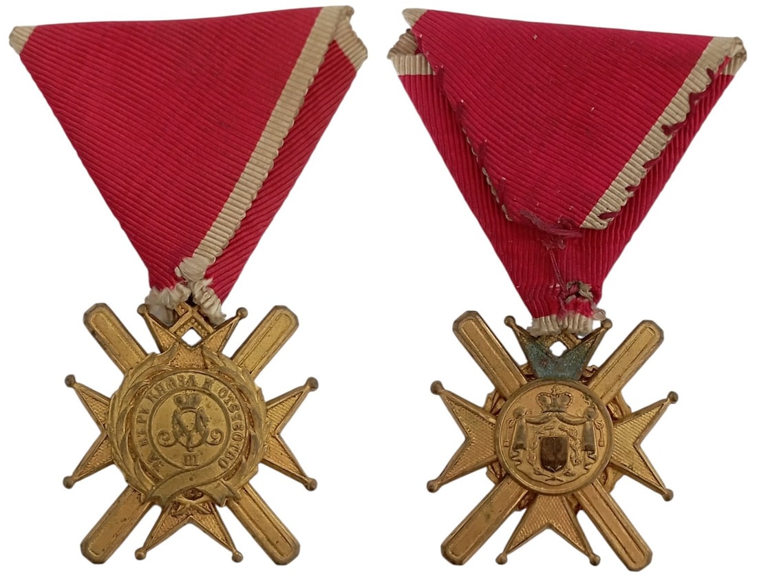 Order of the Cross of Takovo, instituted in 1865: Breast Badge, 41x34 mm, gilt Bronze, original suspension ring and triangular ribbon. I