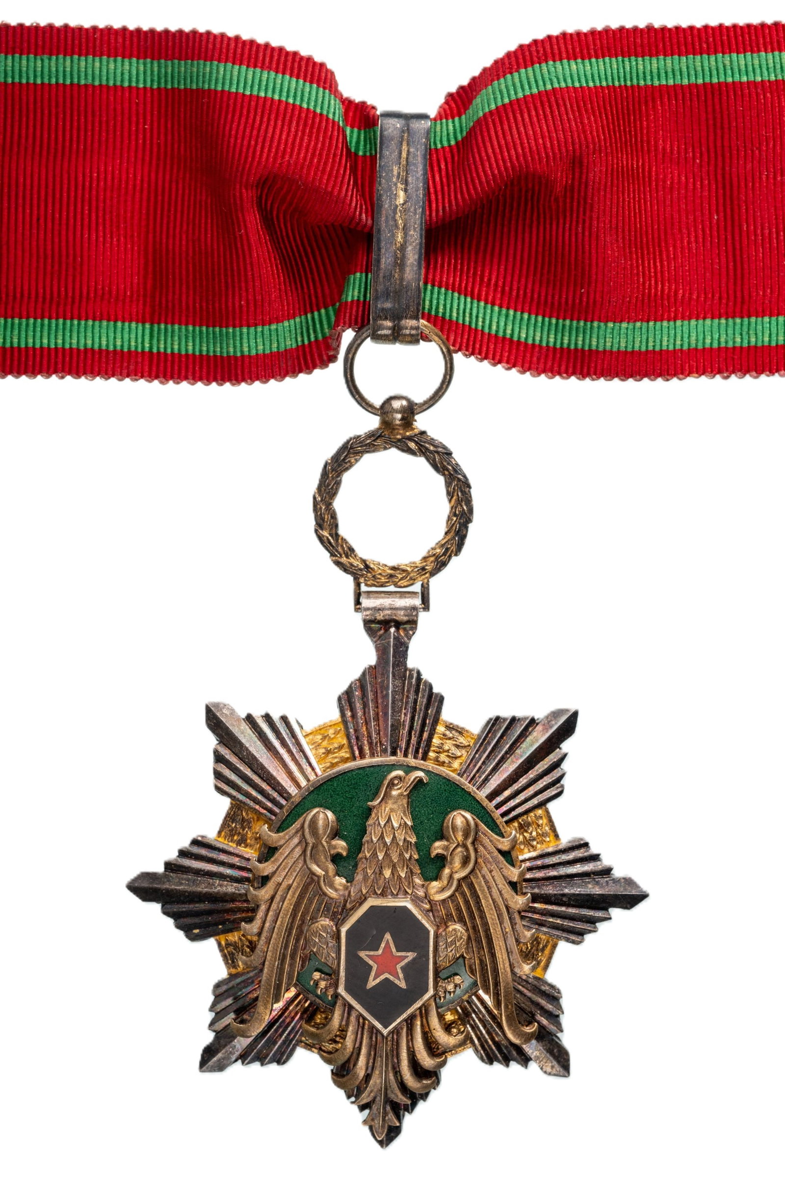 Order of Military Honour: Commander's Cross, 3rd Class, instituted in 1953. Neck Badge, 80x56 mm, partially gilt Silver, one-side enameled, original suspension wreath, riing, loop and ribbon. Extremely fine condition and