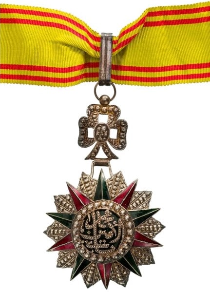 ORDER OF NICHAN AL IFTIKHAR: Commander's Cross, 3rd Class, Mohamed es Sadok Bey (1859 - 1882). Neck Badge, 92x57 mm, Silver, one side enameled, original suspension ring and neck ribbon. A superb high quality! I