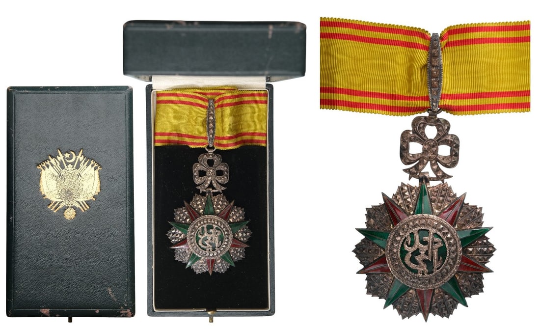 ORDER OF NICHAN AL IFTIKHAR: Commander's Cross, 3rd Class, Sidi Ahmed (1929 - 1942). Neck Badge, 86x58 mm, Silver, partially enameled, original suspension ring, loop and ribbon, in case of issue by "M. Spez - Tunis" with gilt wea