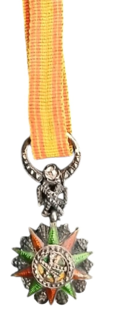ORDER OF NICHAN AL IFTIKHAR: Officer's Cross Miniature with DIAMOND, 4th Class. Breast Badge, 19x12 mm, Silver with brilliant cut rays, one superimposed Diamond, central medallion silver, enameled, original ornamented suspension 