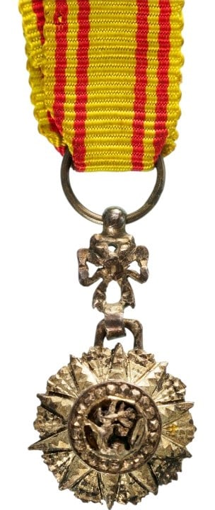 ORDER OF NICHAN AL IFTIKHAR: Miniature Breast Badge, 20x13 mm., Silver, center enameled, original suspension device, ring and ribbon. A beautiful miniature! I
