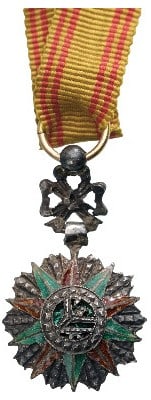 ORDER OF NICHAN AL IFTIKHAR: Miniature Breast Badge, 21x12 mm., Silver, center enameled, original suspension device, ring and ribbon. A very fine miniature! I