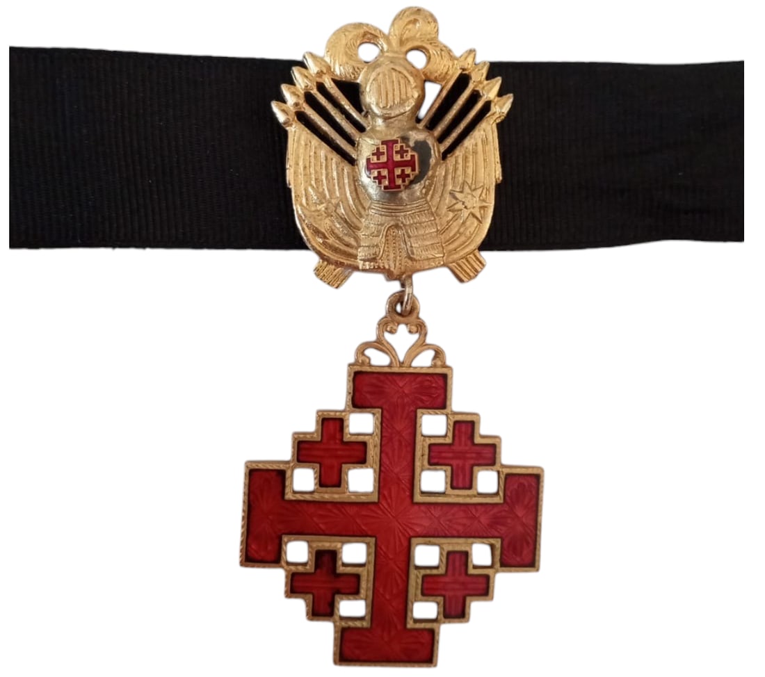 ORDER OF THE HOLY SEPULCHRE: Commander's Cross, 3rd Class, instituted after 1099. Neck Badge, 83x38 mm, gilt Bronze, with red enameled arms, suspension trophee and original neck ribbon. Mint condition! I