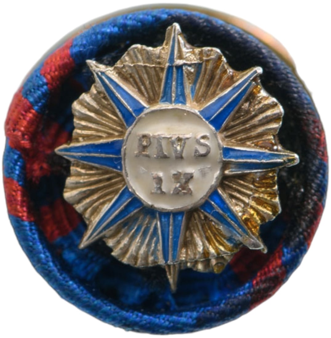 ORDER OF PIUS IX: Miniature Rosette, instituted in 1847. Breast Badge, 20 mm., Silver, one-side enameled, central medallions enameled, fixation clasp on reverse. A scarce miniature, in excellent condition. I R!