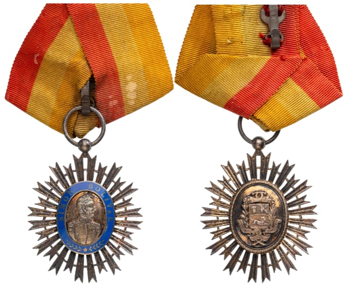 Order of the Libertador, instituted in 1880: Knight's Cross, instituted in 1980. Breast Badge, 50x40 mm,, Silver, superimposed parts enameled, original suspension ring and ribbon. Attractive badge, in very fine condition! I-