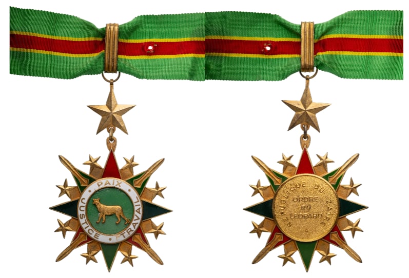 National Order of the Leopard: Commander's Cross, 3rd Class, instituted in 1966. Neck Badge, 102x83 mm., gilt Bronze, original suspension ring, star, ring, loop and short ribbon. A very imposing badge, in extremely fine condition! 